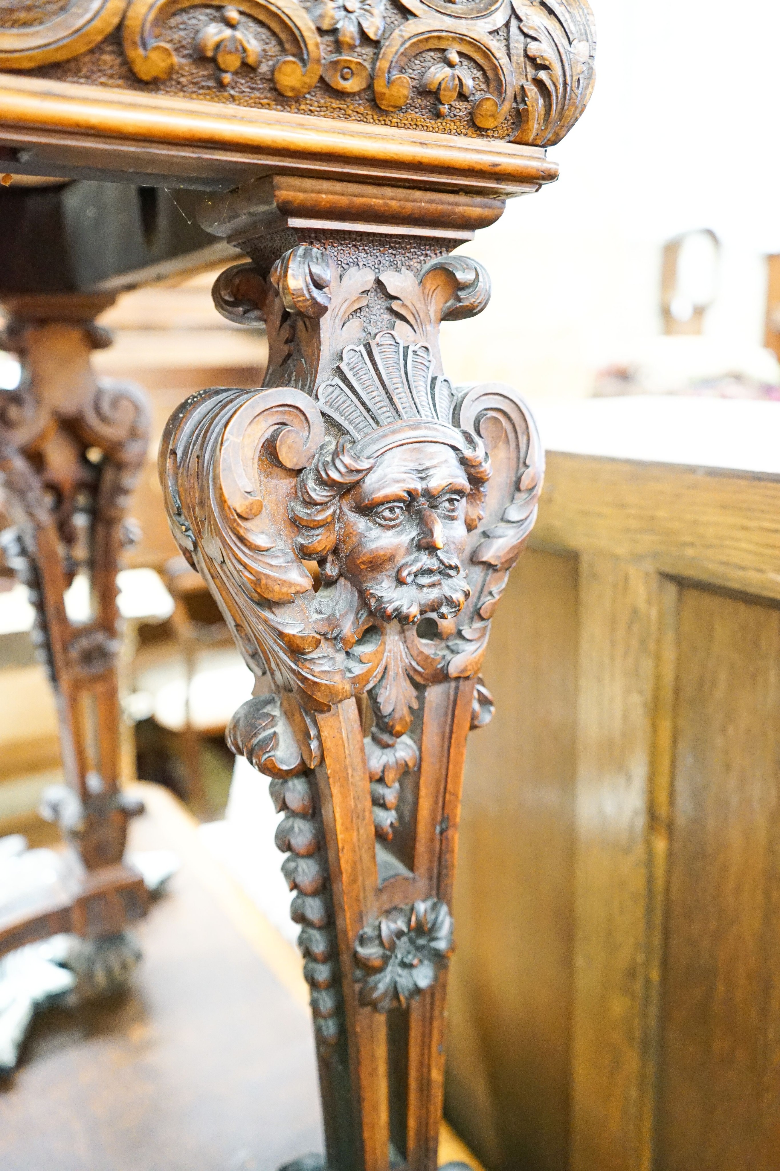 A Flemish carved walnut and beech centre table, width 100cm, depth 63cm, height 77cm